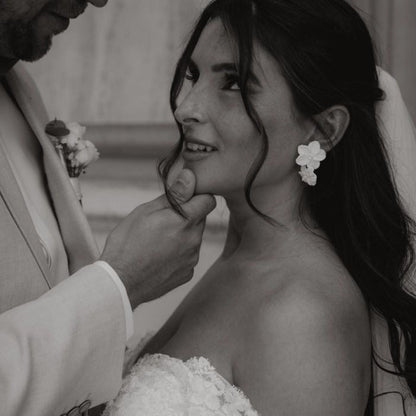 bride wearing double floral earrings