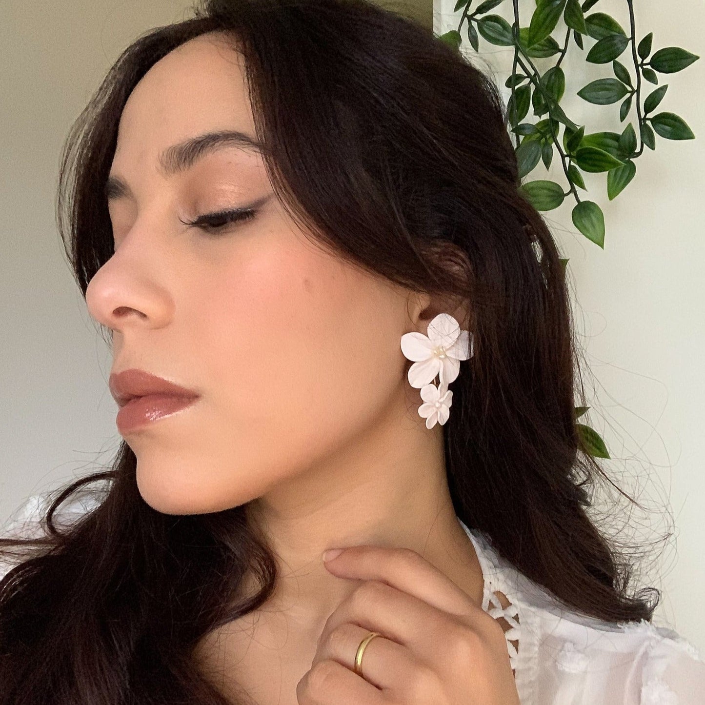 bride with double flower earrings for her wedding