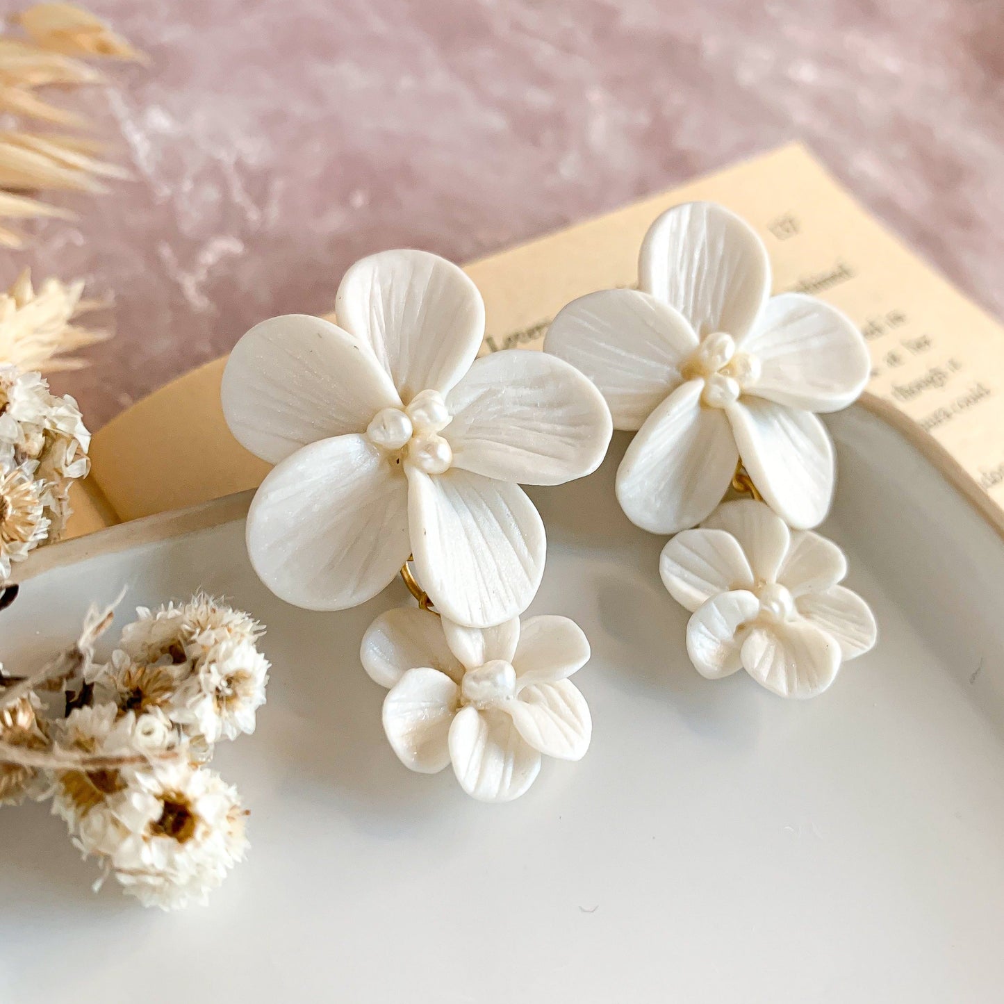 white double flower earrings in another angle