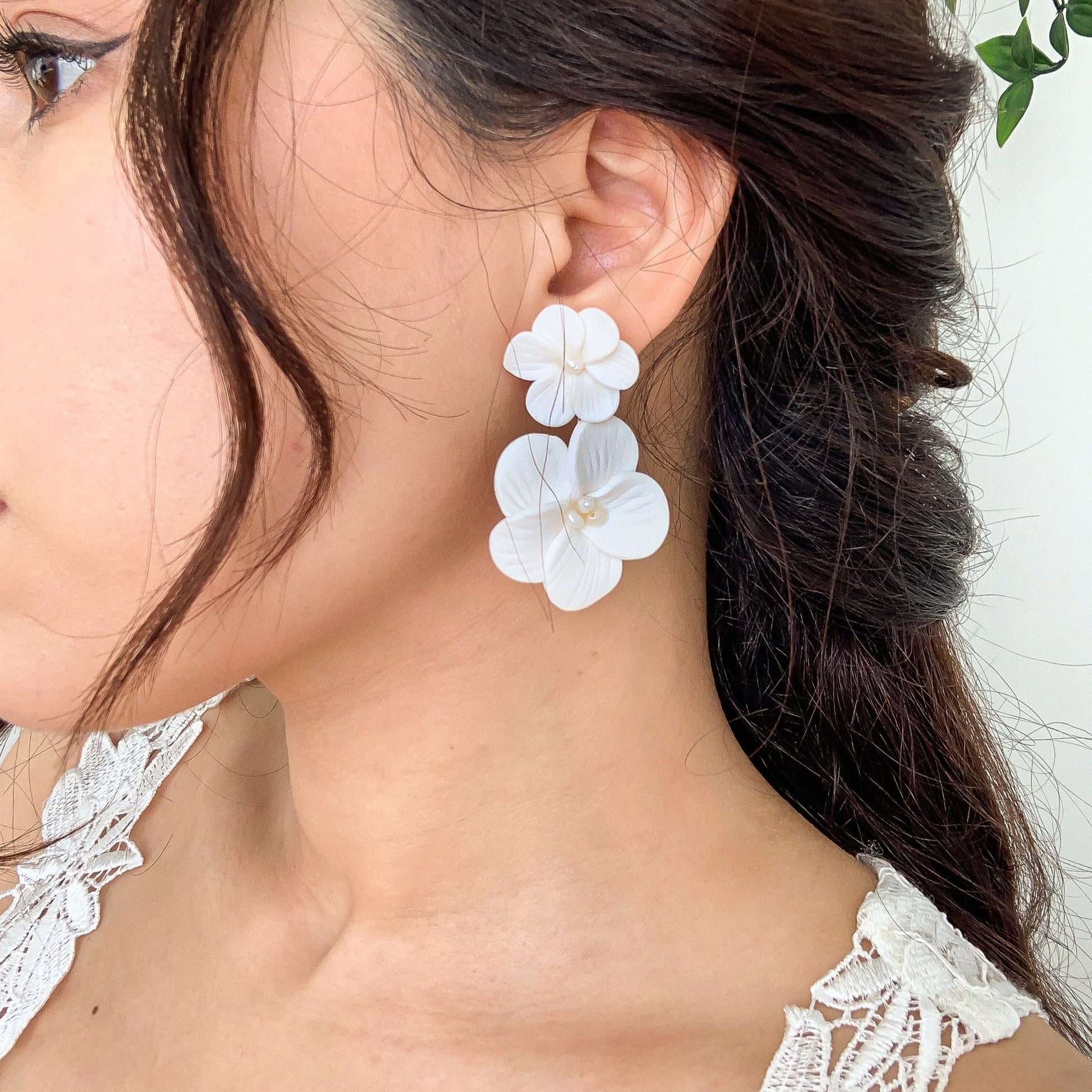 double floral earrings on the bride