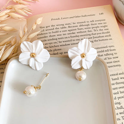 the flower earrings are adorned with a beautiful freshwater pearl you can use as a dangles or stud