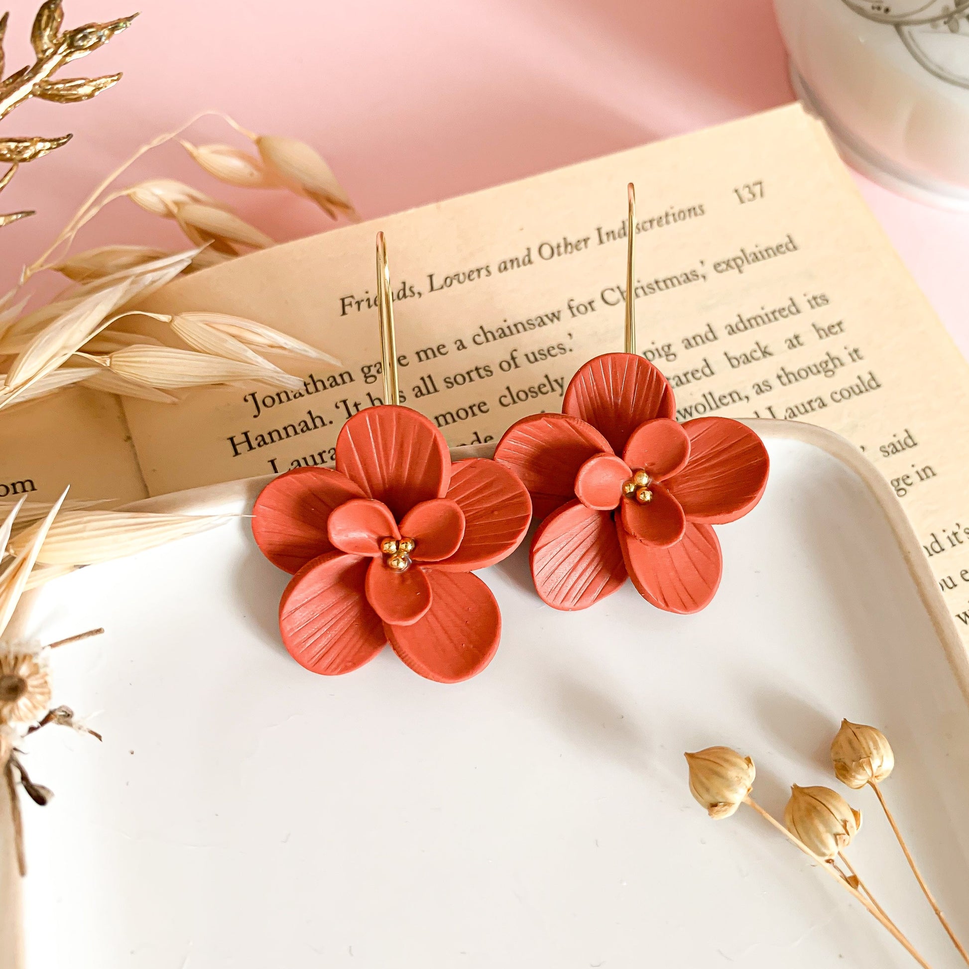 burnt orange flower dangle earrings in clay