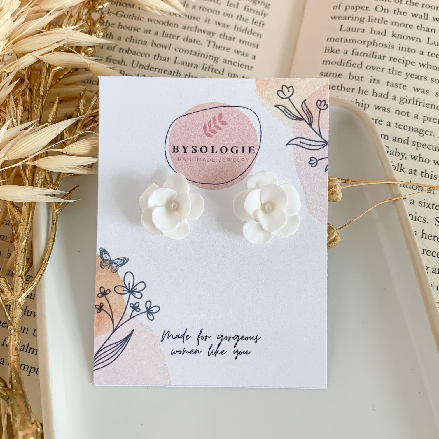 White small flower earrings in a display