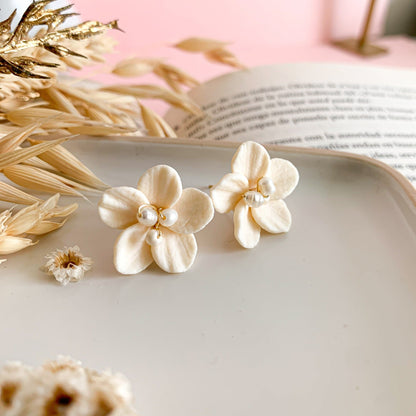 ivory flower clay earrings at another angle