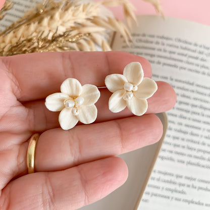 hand-measured ivory flower clay earrings