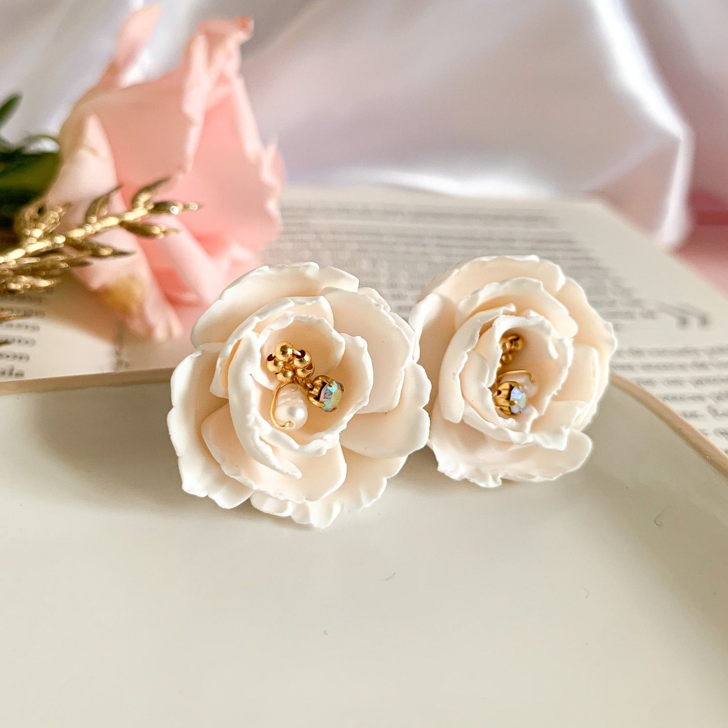 Peony flower design earrings with pearls and beads wrapped in wire in the center