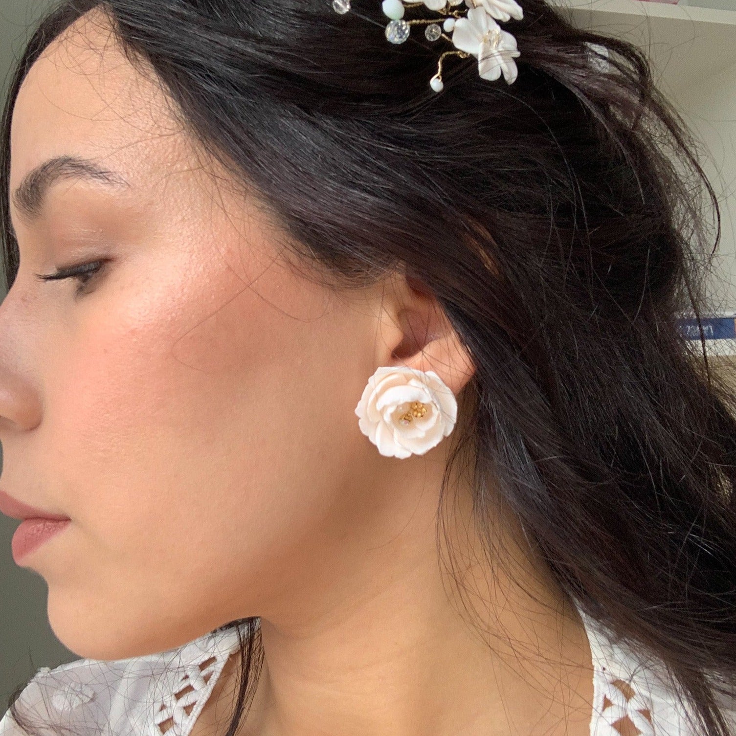 model with peony flower stud earrings