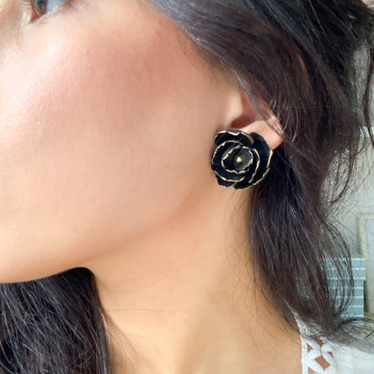 Model wearing black peony stud earrings