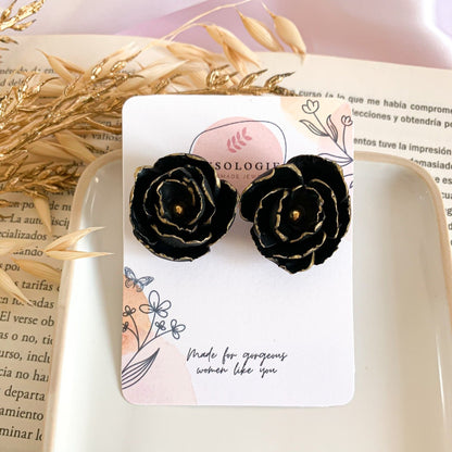 black flower stud earrings in polymer clay