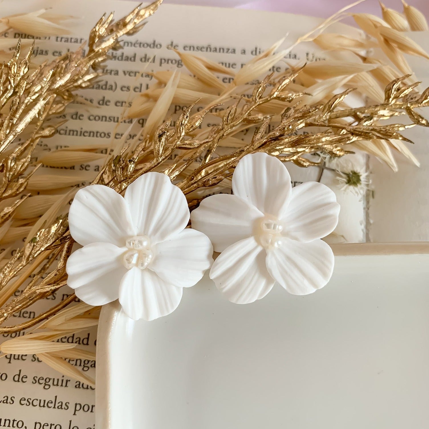 white flower stud earrings handmade in polymer clay with pearls in the center