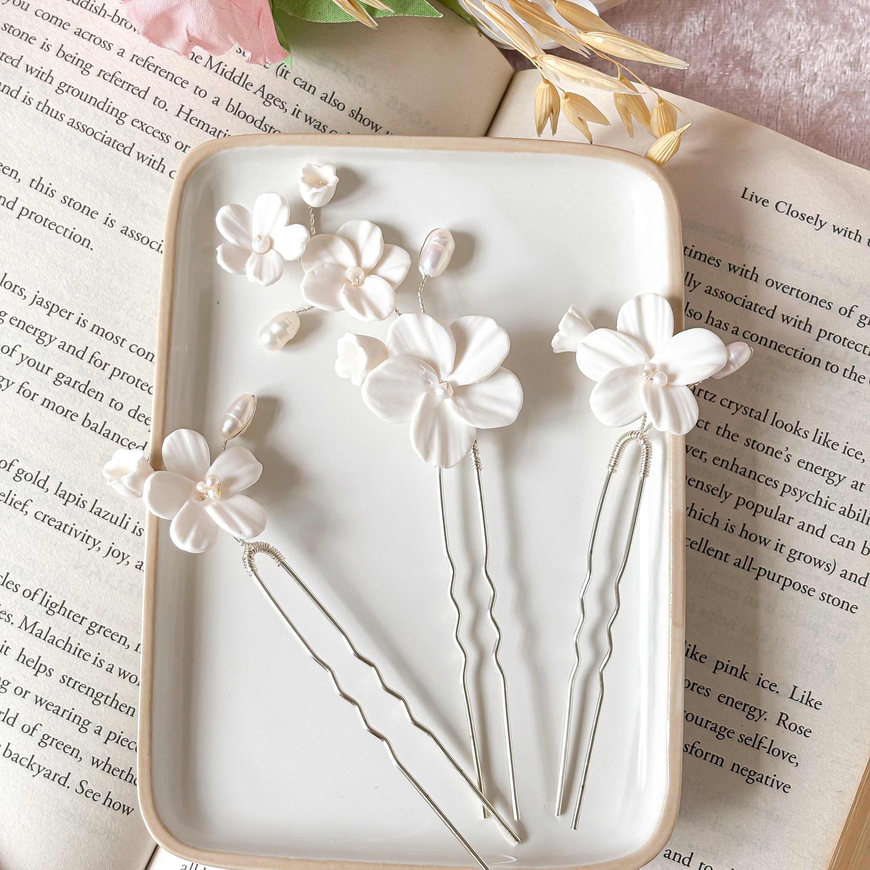 Witte bloemen bruidshaarspelden met parel